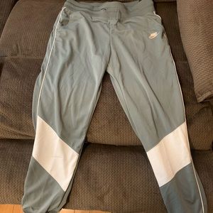 Gray and white Nike athletic joggers